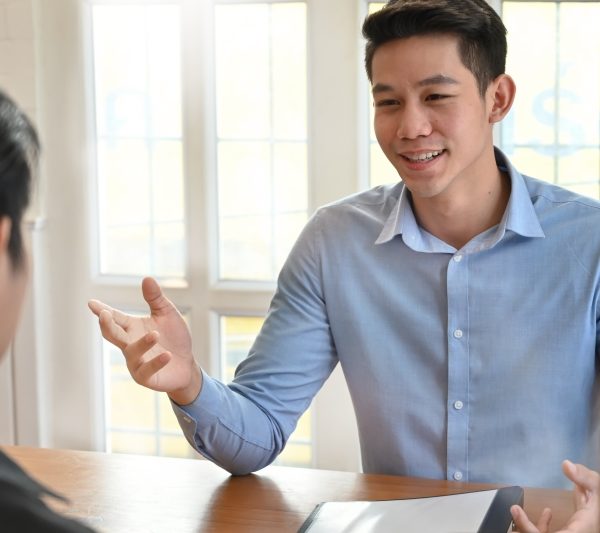 Young man talking with interview job in modern office.