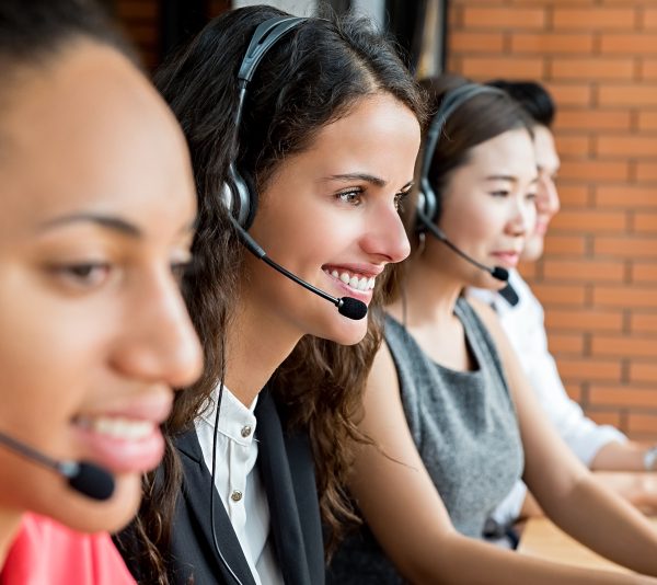 Smiling multiethnic telemarketing customer service agent team, call center job concept